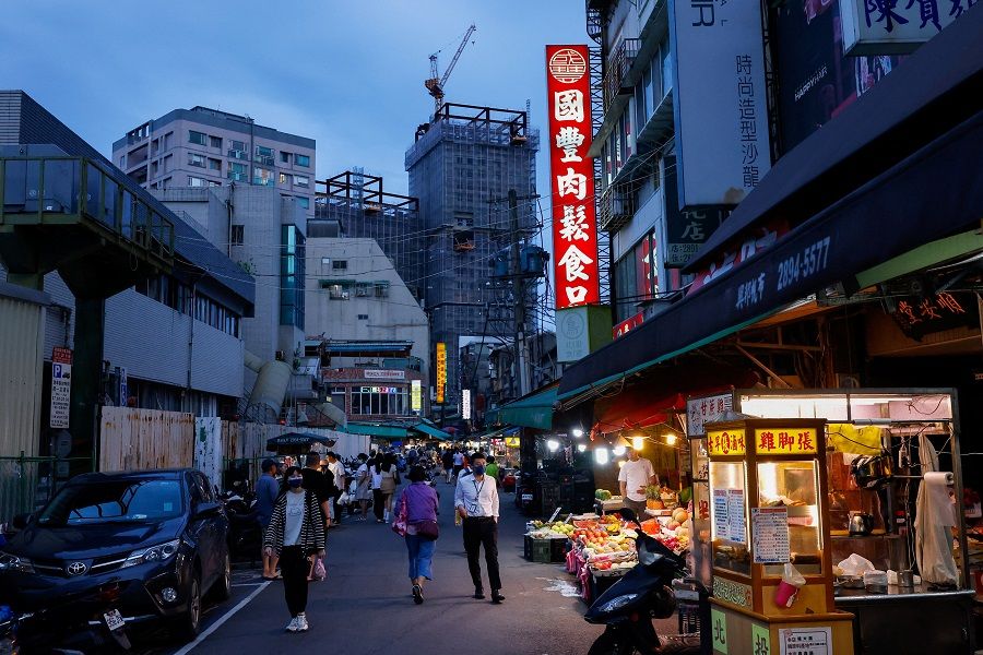 People shop at an evening market in Taipei, Taiwan, 15 June 2023. (Ann Wang/Reuters)