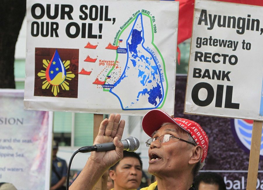 A demonstrator speaks during a rally regarding the disputed islands in the South China Sea, in front of the Chinese Consulate in Makati, Metro Manila, the Philippines, 31 August 2015. (Janis Alano/Reuters)