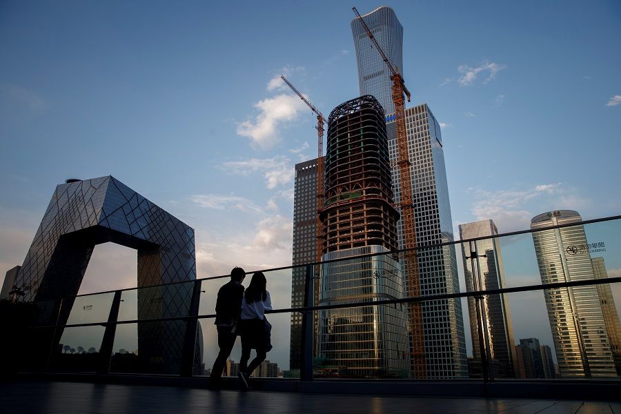 People look at the skyline of the central business district in Beijing, China, 16 April 2020. (Thomas Peter/File Photo/Reuters)