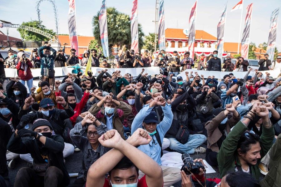 Activists gather to protest against a controversial new law which critics fear will favour investors at the expense of labour rights and the environment, in Surabaya on 10 November 2020. (Juni Kriswanto/AFP)