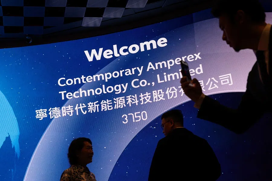 Guests pose for photos during the CATL listing ceremony at the Hong Kong Stock Exchange in Hong Kong, 20 May 2025. (Tyrone Siu/Reuters)