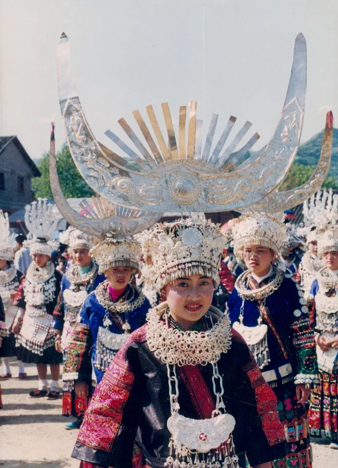 A Miao girl in Guizhou wearing a bull-horn-shaped headpiece, 2000.