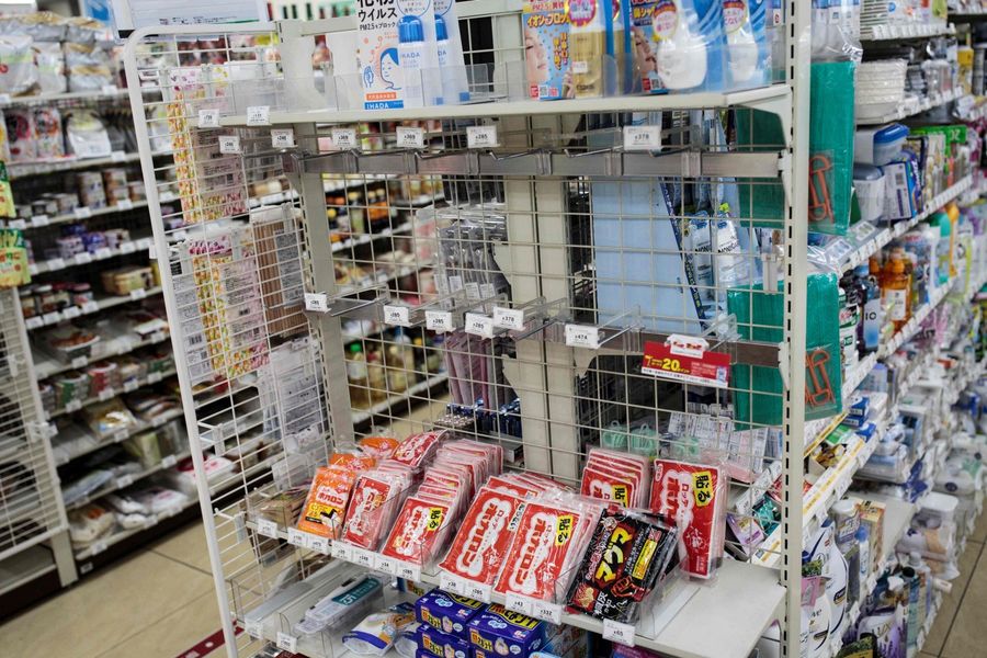 The picture shows empty shelves for face masks in a convenience store in Tokyo on 3 February 2020. (Behrouz Mehri/AFP)