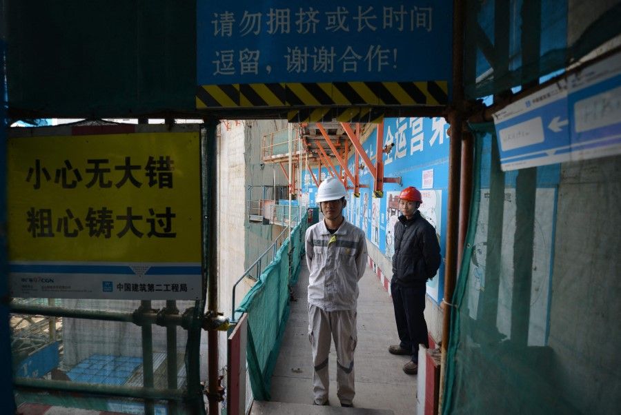 This file photo taken on 8 December 2013 shows workers at the joint Sino-French Taishan Nuclear Power Station outside the city of Taishan in Guangdong province. (Peter Parks/AFP)