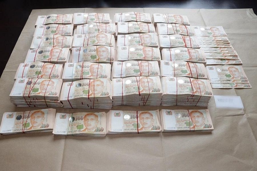 Hundred-dollar bills used as "petty cash". (Singapore Police Force)