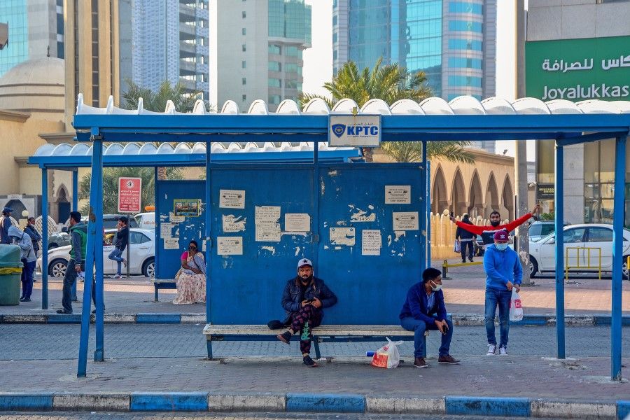 Commuters at a bus terminal in Kuwait City, Kuwait, on 8 January 2022. (Bassam Zidan Ahlawy/Bloomberg)
