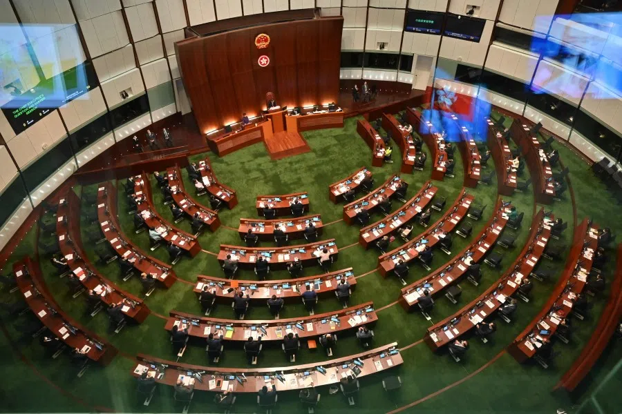 This overhead view shows Hong Kong's Chief Executive Carrie Lam (top left) speaking to Legislative Council (LegCo) members during the first session of a new "patriots only" legislature in Hong Kong on 12 January 2022. (Peter Parks/AFP)