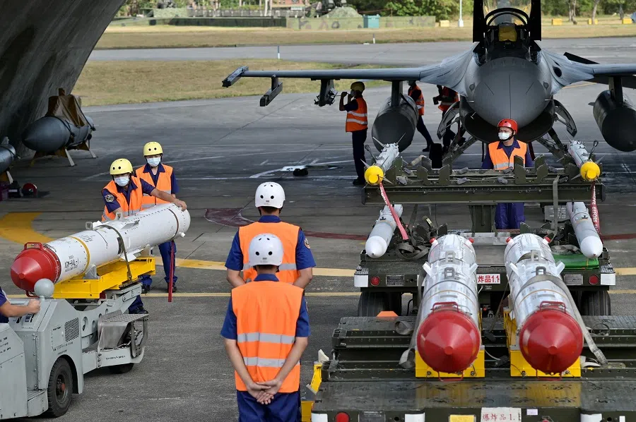 Air Force soldiers prepare to load US-made Harpoon AGM-84 anti-ship missiles in front of an F-16V fighter jet during a drill at Hualien Air Force Base in Taiwan, on 17 August 2022. (Sam Yeh/AFP)