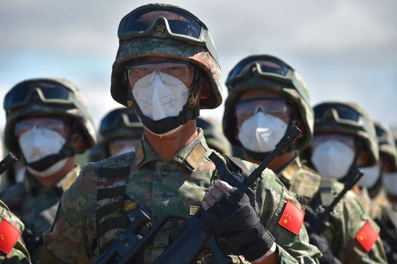 Chinese service members take part in a ceremony opening Vostok 2022 military exercises at a firing ground in the far eastern Primorsky region, Russia, 31 August 2022. (Russian Defence Ministry/Handout via Reuters)