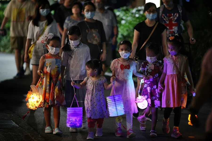 People go on a lantern walk to celebrate the Mid-Autumn Festival in Singapore. (SPH Media)