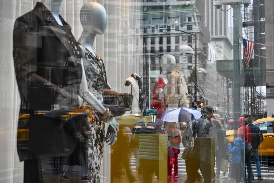 People walk past a clothing store in the Manhattan borough of New York City, US on 11 April 2025. (Angela Weiss/AFP)