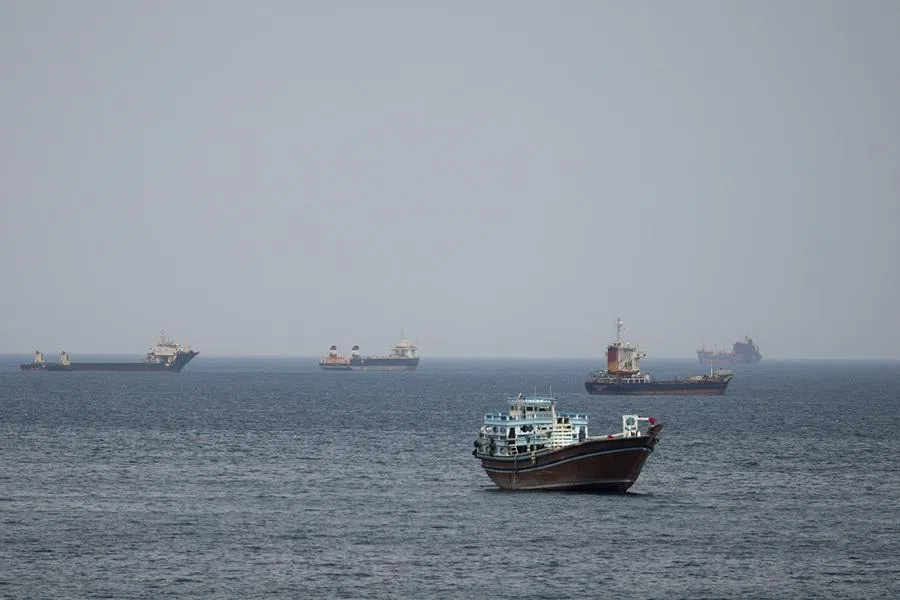 Ships and boats in the Strait of Hormuz, Musandam, Oman, on 22 April 2026. (Stringer/Reuters)