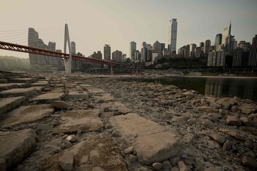 A general view shows the dried-up riverbed of the Jialing river, a tributary of the Yangtze River in China's southwestern city of Chongqing on 25 August 2022. (Noel Celis/AFP)