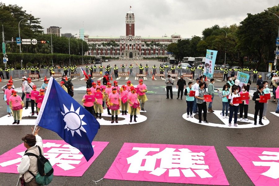 Environment groups gather to oppose a key LNG terminal that could help resolve persistent power woes for the semiconductor powerhouse island but may destroy a delicate algal reef in Taipei, Taiwan, 12 December 2021. (Ann Wang/Reuters)
