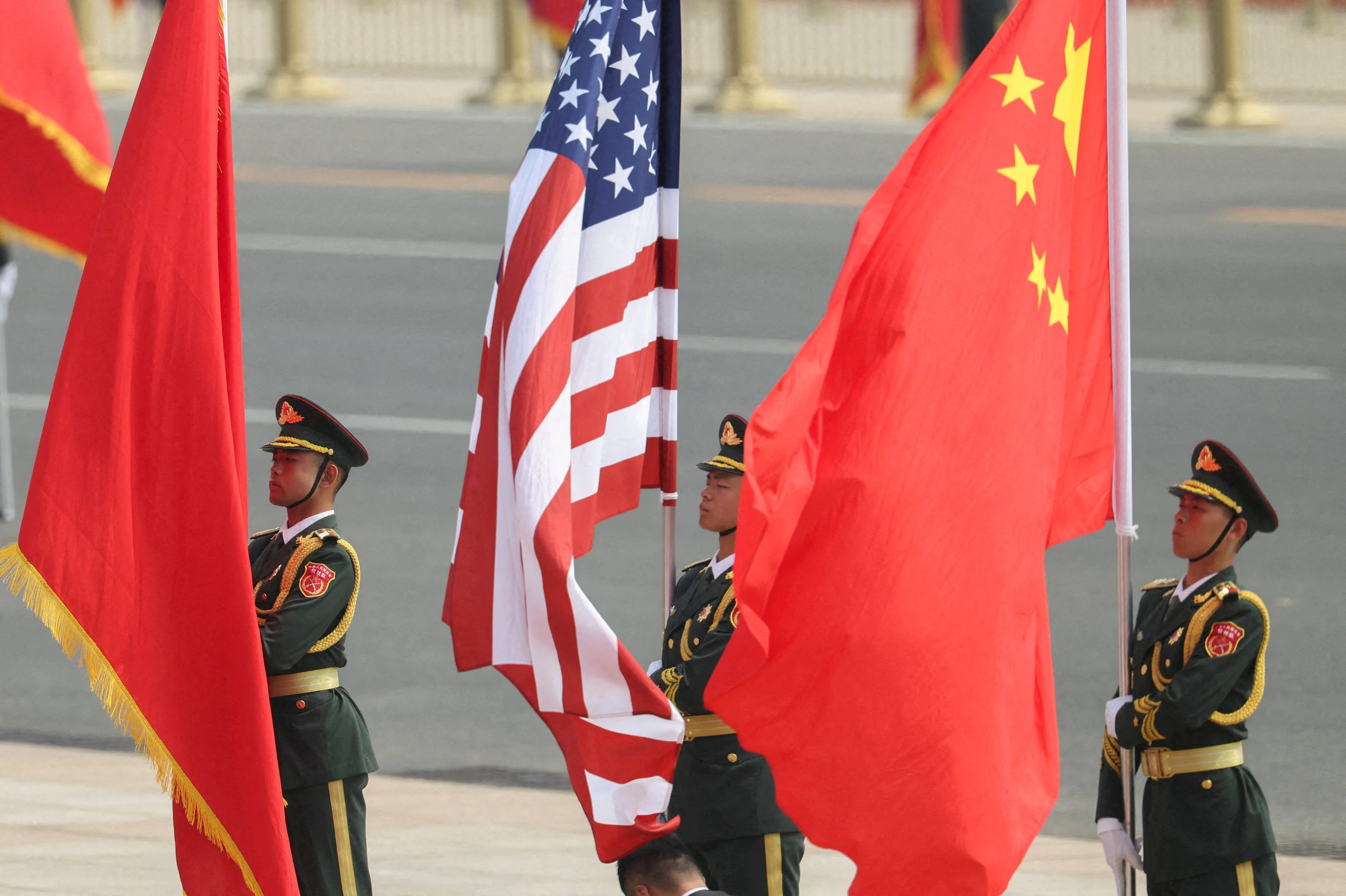 Chinese People's Liberation Army honour guards hold Chinese and US flags, before the welcome ceremony for US President Donald Trump by Chinese President Xi Jinping at the Great Hall of the People in Beijing, China, on 14 May 2026.