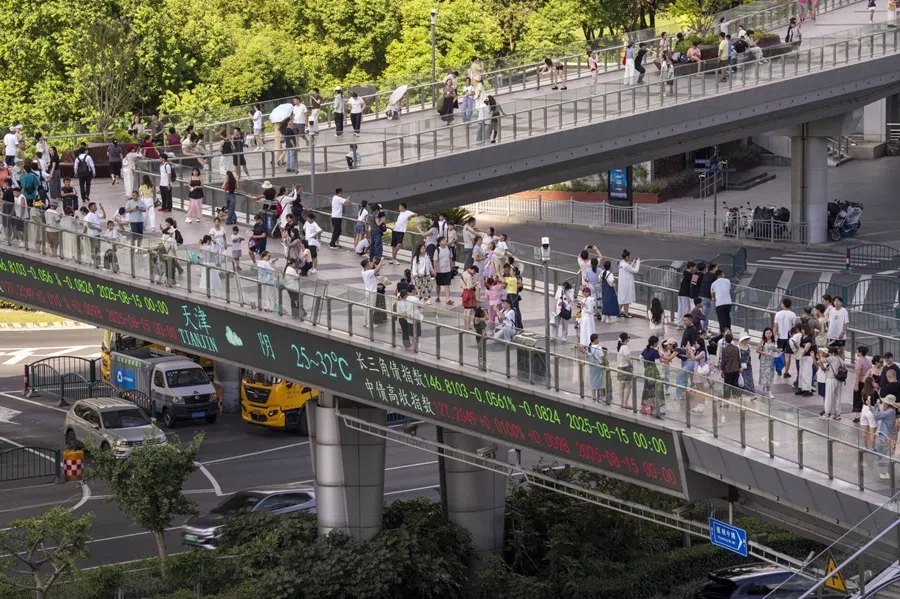 An electronic ticker displays stock figures in Pudong’s Lujiazui Financial District in Shanghai, China, on 18 August 2025. (Raul Ariano/Bloomberg)