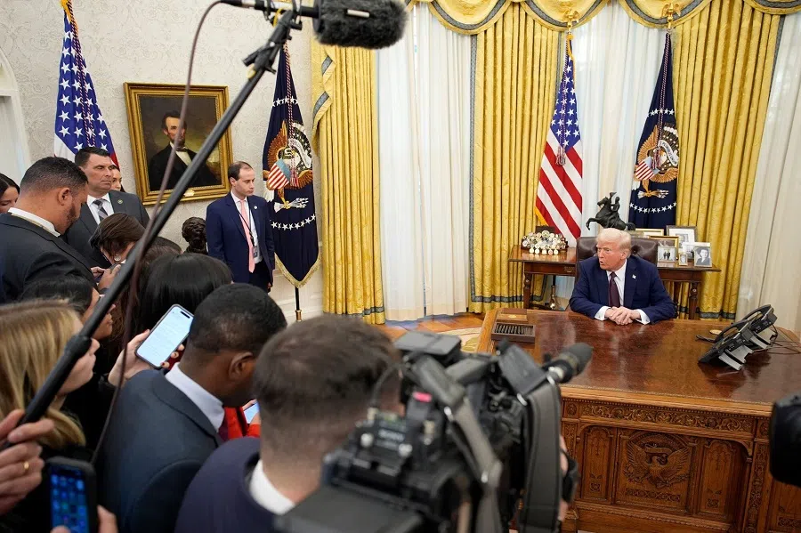 US President Donald Trump speaks to members of the media after signing executive orders in the Oval Office of the White House in Washington, DC, US, on 23 January 2025. (Yuri Gripas/Bloomberg)