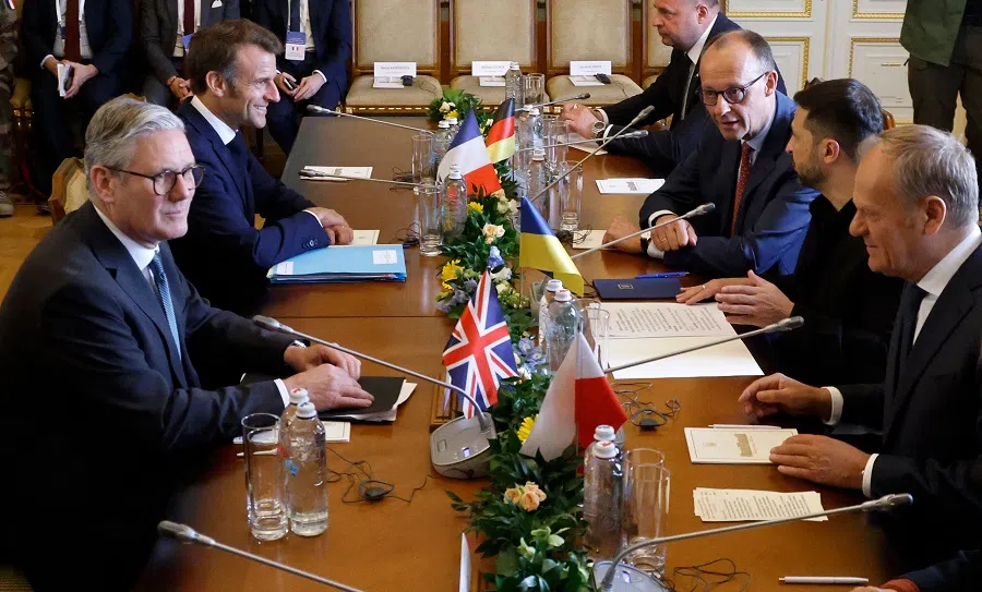 Ukraine’s President Volodymyr Zelenskyy (second from right) greets Britain’s Prime Minister Keir Starmer (left), France’s President Emmanuel Macron (second from left), Poland’s Prime Minister Donald Tusk (right) and Germany’s Chancellor Friedrich Merz (third from right) during a meeting at the Mariinskyi Palace, the official residence of the president of Ukraine, in Kyiv on 10 May 2025. The leaders of Britain, France, Germany and Poland made an unprecedented joint visit to Kyiv for talks to urge Russia to agree a ceasefire. (Ludovic Marin/AFP)