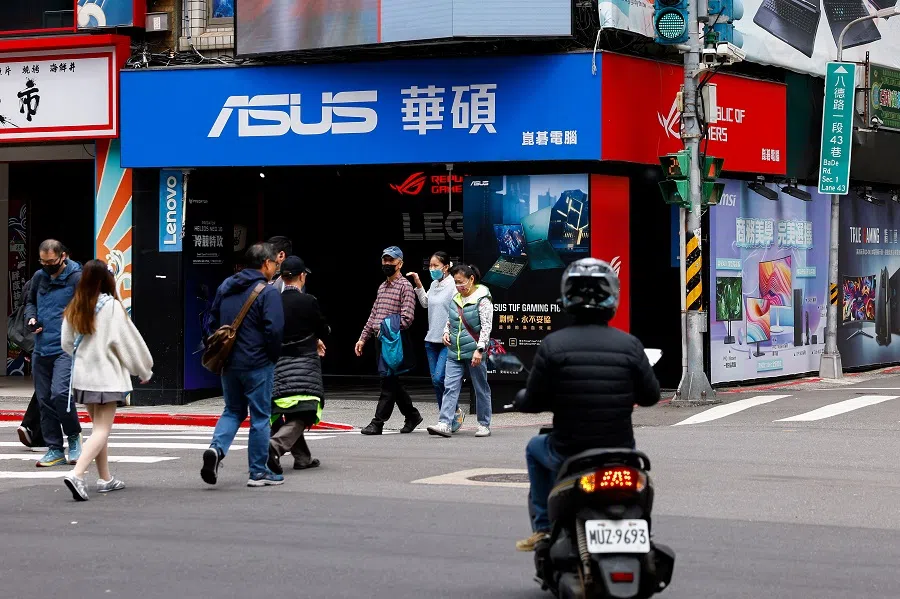 People walk on the street in Taipei, Taiwan, on 3 April 2025. (Ann Wang/Reuters)