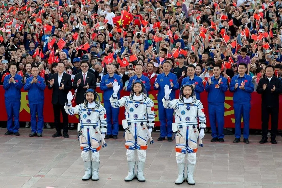 Astronauts Zhu Yangzhu, Zhang Zhiyuan, and Lai Ka-ying, who is the first astronaut from Hong Kong, wave during a see-off ceremony before taking part in the Shenzhou-23 spaceflight mission to China's Tiangong space station, at Jiuquan Satellite Launch Center, near Jiuquan, Gansu province, China, on 24 May 2026.