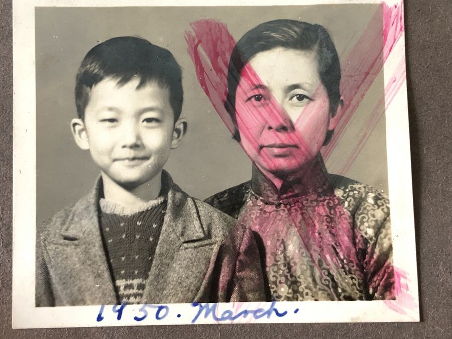 Teo Soon Kim (right) with only son Peter Wang, taken in March 1950. The photo was vandalised during the Cultural Revolution.