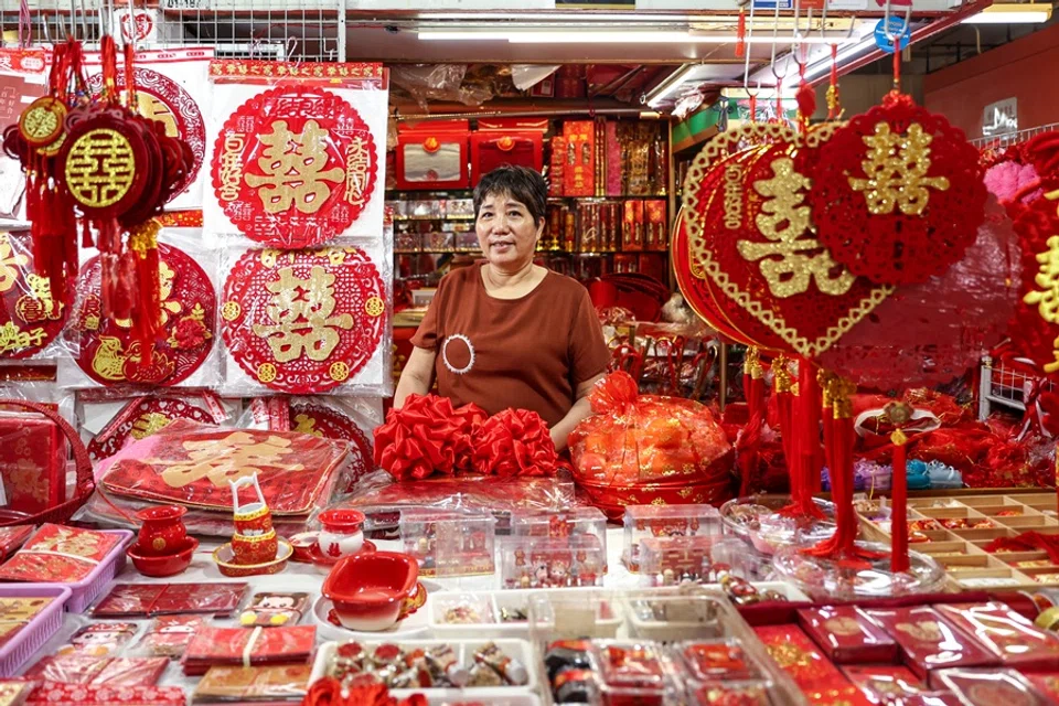 Jenny Zheng has borne witness to marital unions in Singapore for the past 27 years as a shopkeeper of wedding paraphernalia.
