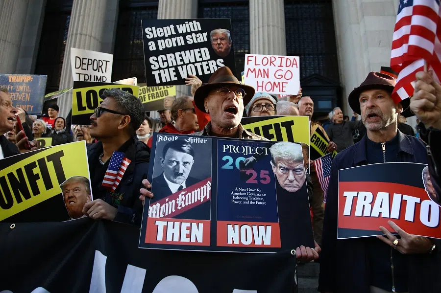 Detractors of former US President and Republican presidential candidate Donald Trump protest as his supporters arrive for a campaign rally at Madison Square Garden in New York on 27 October 2024.