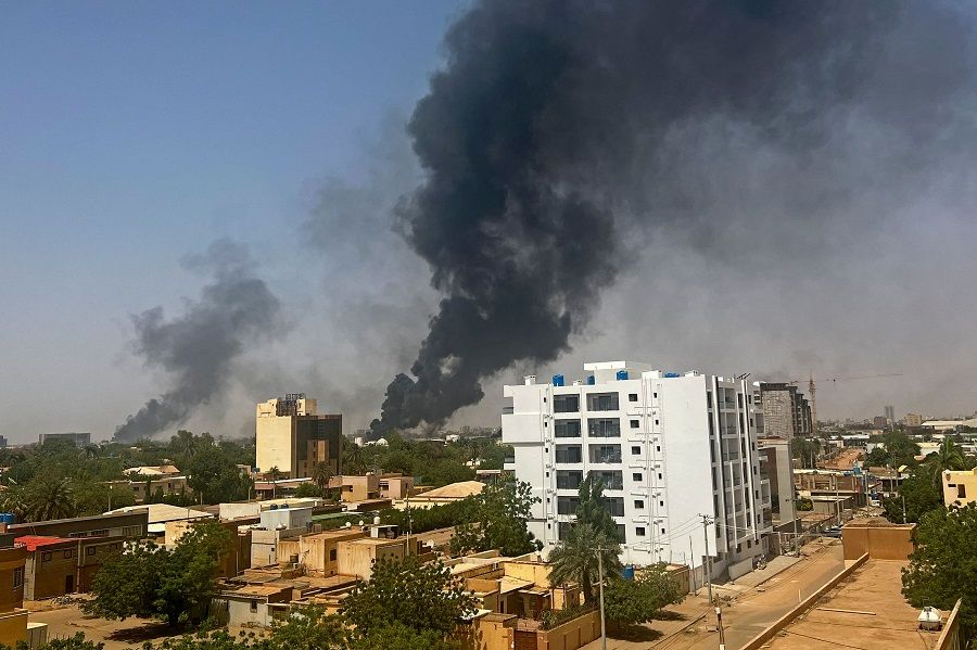 Smoke billows above residential buildings in Khartoum, Sudan, on 16 April 2023, as fighting in Sudan raged for a second day in battles between rival generals. (AFP)
