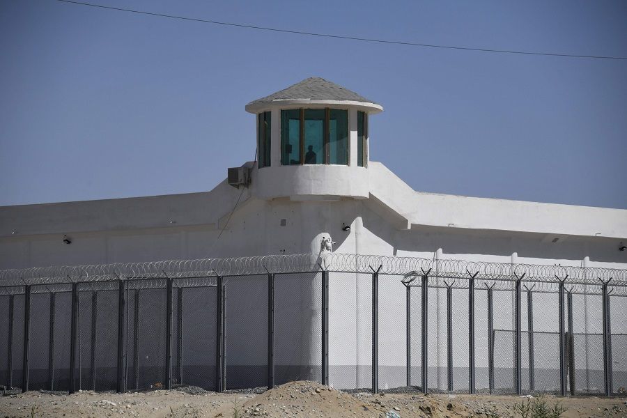 This file photo taken on 31 May 2019 shows a watchtower on a high-security facility near what is believed to be a re-education camp where mostly Muslim ethnic minorities are detained, on the outskirts of Hotan, Xinjiang. (Greg Baker/AFP/Badung Police)