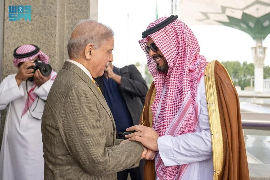 Deputy governor of Makkah region Prince Saud bin Mishaal bin Abdulaziz (right) receives Pakistan's Prime Minister Shehbaz Sharif upon his arrival at Jeddah, Saudi Arabia, 15 April 2026. (Saudi Press Agency/Handout via Reuters)