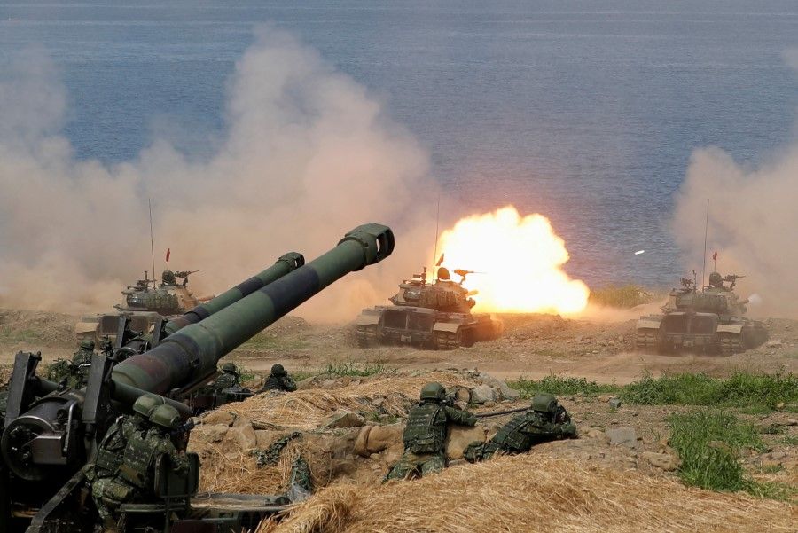 A CM-11 Brave Tiger tank fires during the live fire Han Kuang military exercise, which simulates China's People's Liberation Army (PLA) invading the island, in Pingtung, Taiwan, 30 May 2019. (Tyrone Siu/REUTERS)