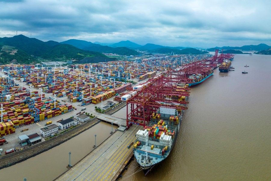 This photo taken on 6 June 2023 shows a cargo ship loaded with containers berthing at Zhoushan port in Ningbo, in China's eastern Zhejiang province. (AFP)