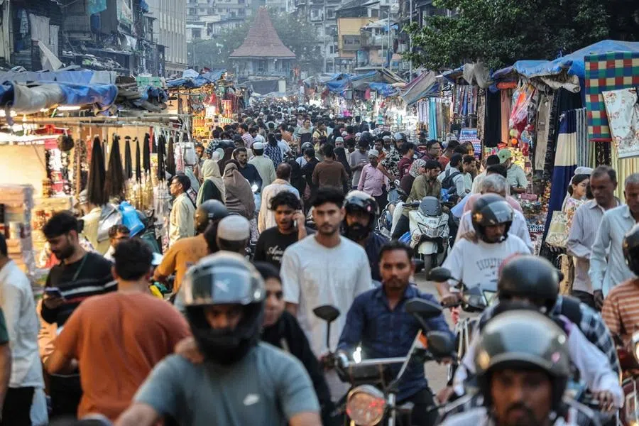 People visit Chor Bazaar in Mumbai on 15 February 2026. (Ludovic Marin/AFP)