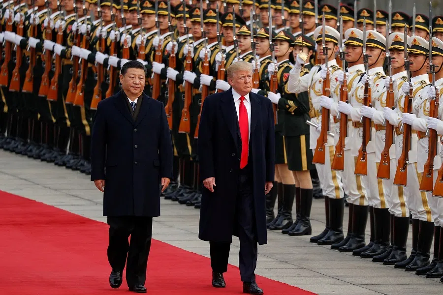 US President Donald Trump takes part in a welcoming ceremony with China’s President Xi Jinping in Beijing, China, 9 November 2017. (Damir Sagolj/Reuters)