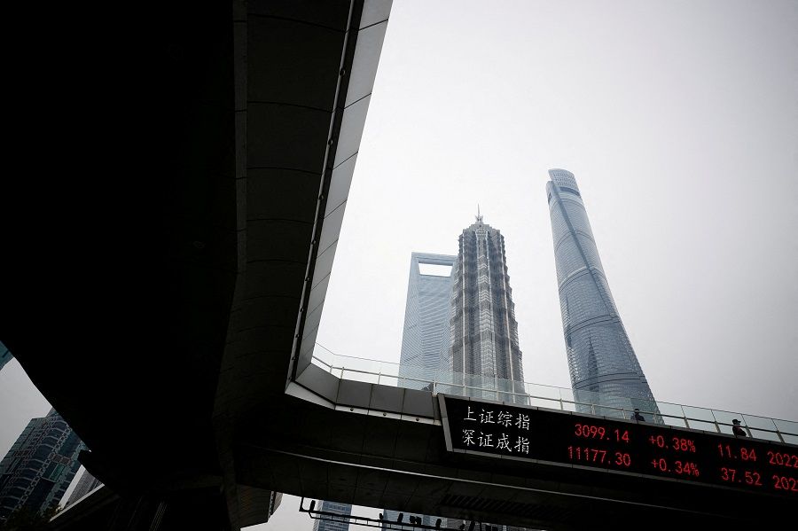 An electronic board shows Shanghai and Shenzhen stock indexes, at the Lujiazui financial district, in Shanghai, China, 14 November 2022. (Aly Song/File Photo/Reuters)