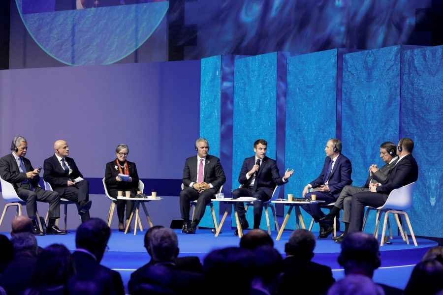 French President Emmanuel Macron, flanked by secretary-general of the Pacific Islands Forum Henry Puna, French Poles ambassador Olivier Poivre d'Arvor, Tunisian Prime Minister Najla Bouden, Colombian President Ivan Duque and Cyprus President Nicos Anastasiades speaks during the high-level segment of the One Ocean Summit in Brest, France, 11 February 2022. (Ludovic Marin/Pool via Reuters)