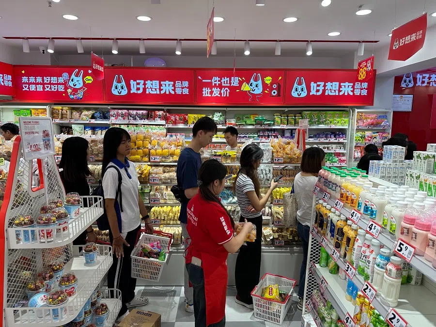 Customers queueing up at a bulk snack store in China. 