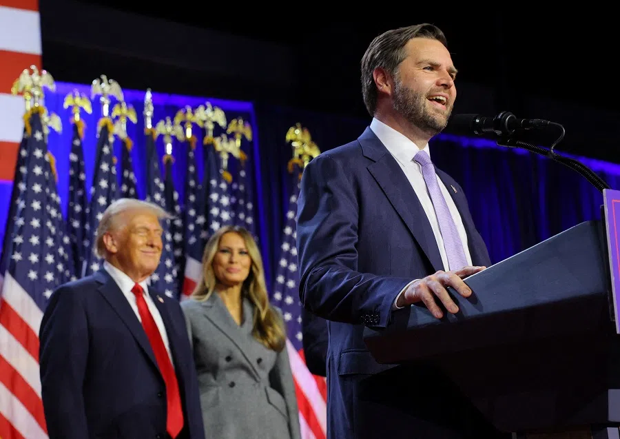 JD Vance speaks as Donald Trump and his wife Melania watch as he addresses supporters at Trump’s rally, at the Palm Beach County Convention Center in West Palm Beach, Florida, US, on 6 November 2024. (Brian Snyder/Reuters)