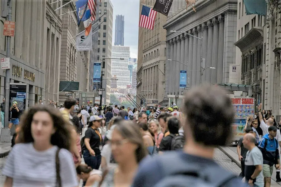 Pedestrians on Wall Street in New York, US, on 8 August 2023. (Victor J. Blue/Bloomberg)