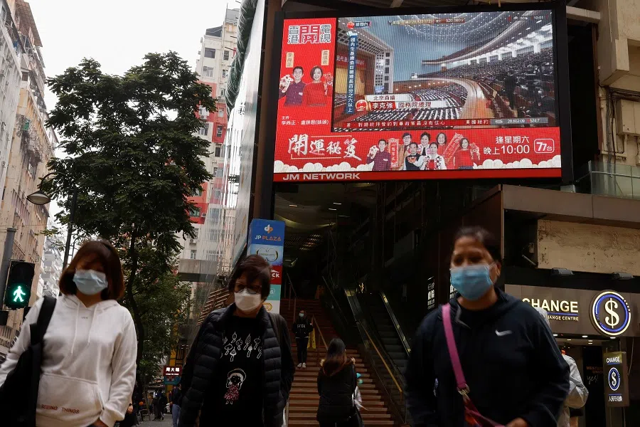 A TV screen showing news over the opening session of the National People's Congress (NPC) is seen in Hong Kong, China, 5 March 2021. (Tyrone Siu/Reuters)