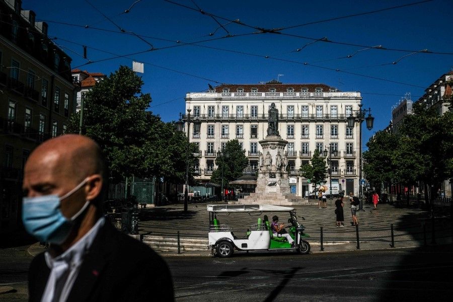 A tuktuk is parked at Camoes square in Lisbon on 14 July 2021. (Patricia de Melo Moreira/AFP)