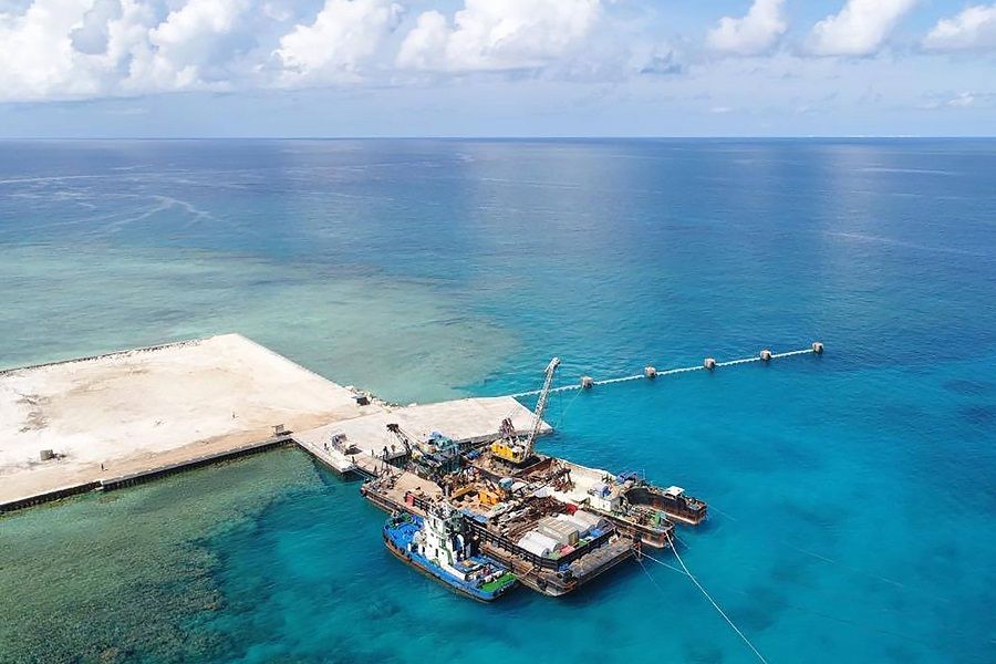 This handout photo received on 9 June 2020 from the Department of National Defense Philippines (DND), shows an aerial shot of the newly constructed beach ramp at Philippine-held Pag-asa Island also known as Thitu Island in the Spratly archipelagos during a visit of Philippine Defence Secretary Delfin Lorenzana. (Handout/Department of National Defense Philippines (DND)/AFP)