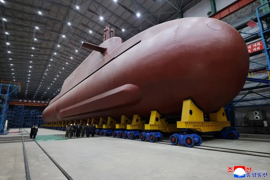 North Korean leader Kim Jong Un visits the construction site of an 8,700-ton nuclear-powered submarine capable of launching surface-to-air missiles in this picture released by North Korea’s official Korean Central News Agency on 25 December 2025.