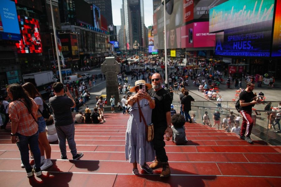 People visit Times Square on 14 April 2023, in New York City. (Kena Betancur/AFP)