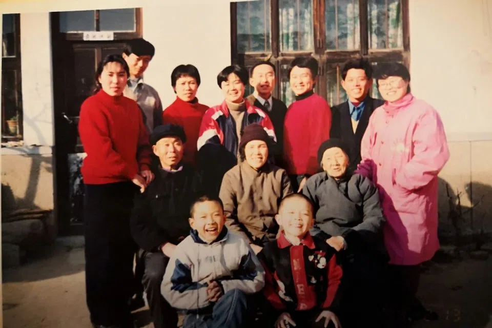 A family portrait with the writer (front row, left). (Courtesy of Pang Ruizhi)
