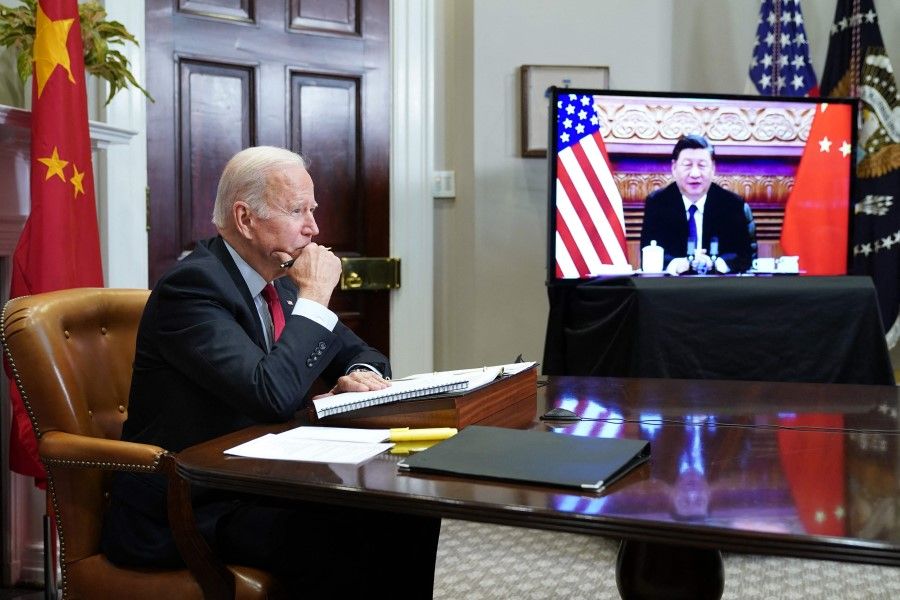 In this file photo taken on 15 November 2021, US President Joe Biden meets with China's President Xi Jinping during a virtual summit from the Roosevelt Room of the White House in Washington, DC. (Mandel Ngan/AFP)