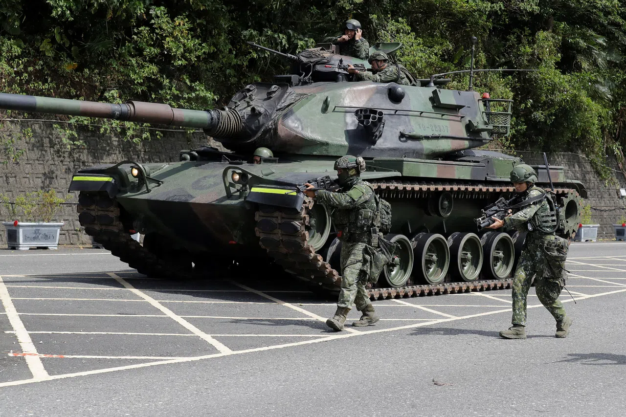 Soldiers participate in a defence mission for a critical harbour during the annual Han Kuang military exercises in Yilan, Taiwan, on 10 August 2026.
