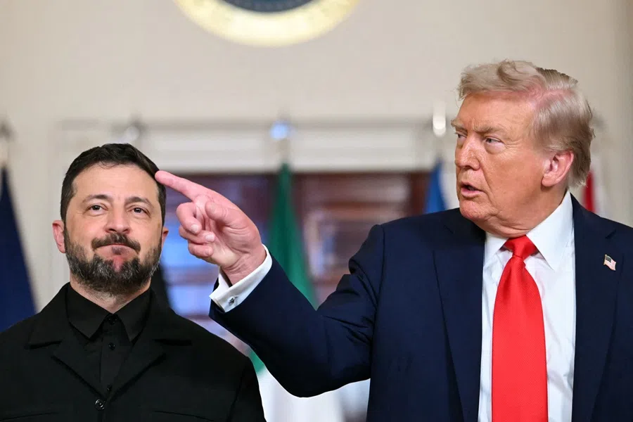 Ukrainian President Volodymyr Zelenskyy and US President Donald Trump stand for a family photo with other European leaders in the Cross Hall of the White House in Washington, DC, on 18 August 2025.