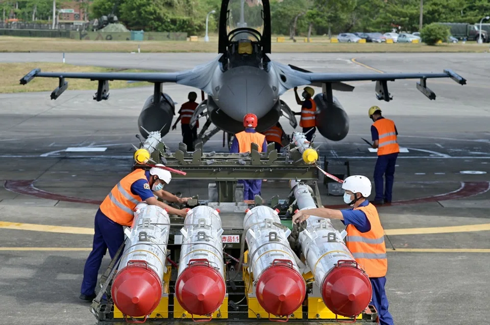 Air Force soldiers prepare to load US-made Harpoon AGM-84 anti-ship missiles in front of an F-16V fighter jet during a drill at Hualien Air Force Base in Taiwan on 17 August 2022. (Sam Yeh/AFP)