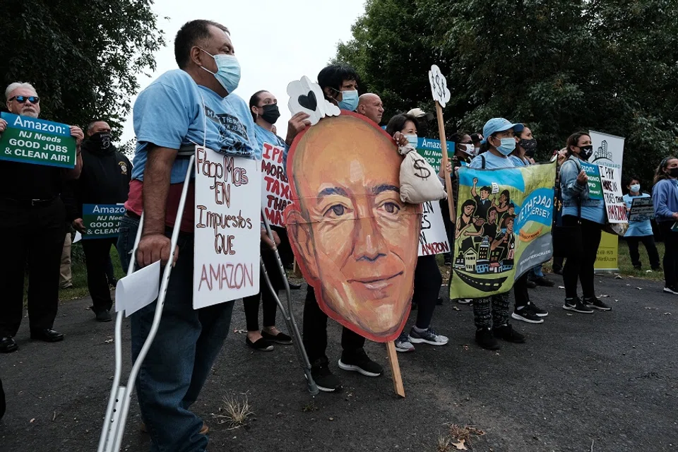 Amazon workers, environmental advocates, labour groups, and small business owners participate in a rally and news conference to protest plans for a new Amazon air cargo mega-hub at the Newark International Airport on 6 October 2021 in Newark, New Jersey, US. (Spencer Platt/Getty Images/AFP)